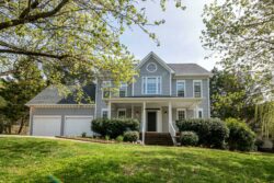 two-story house with grey siding